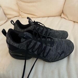 Men’s Black Puma shoes.